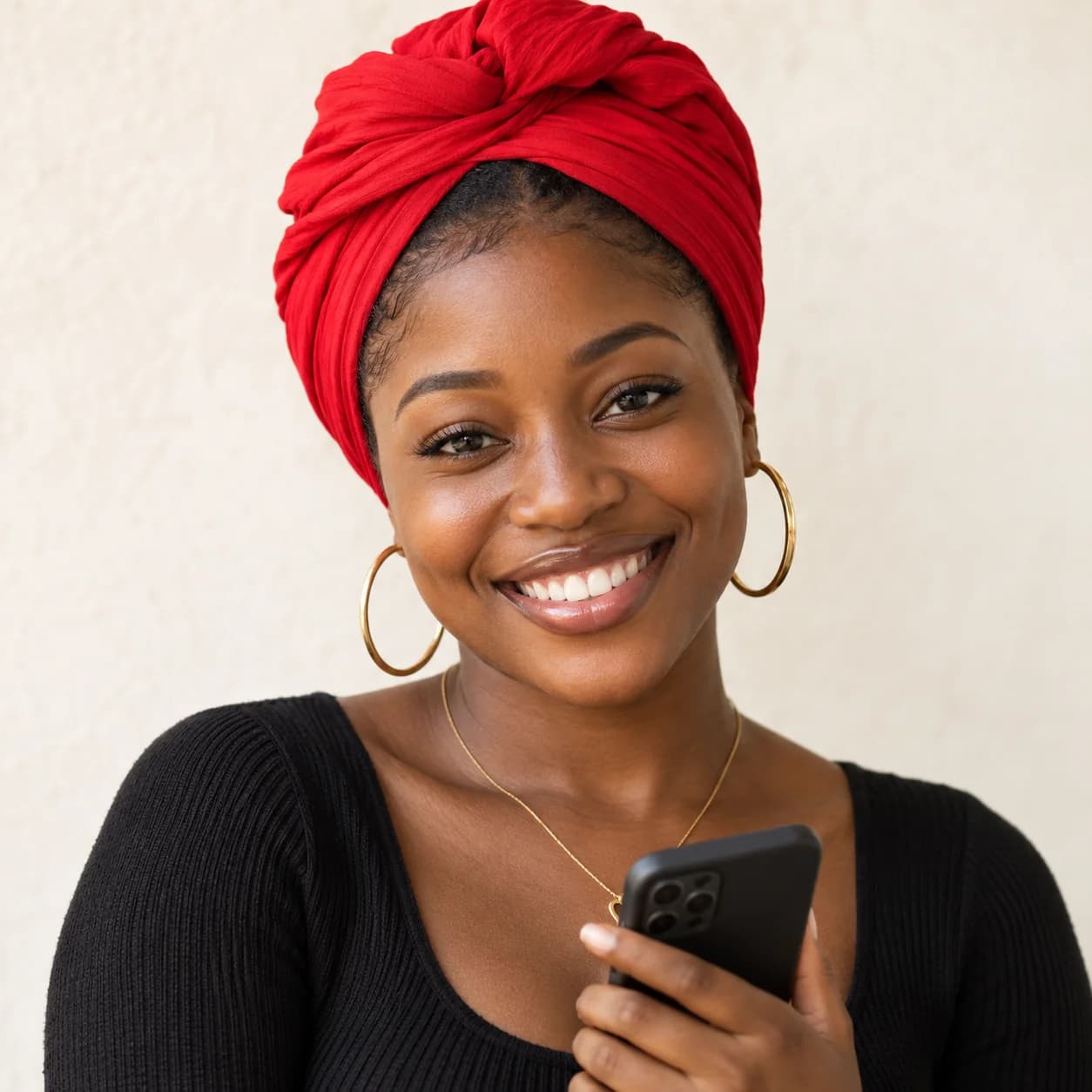 A creator smiling with her phone